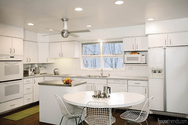 White cabinetry completes a mid-century modern design