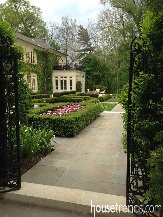 Paver stones line the way to a charming garden