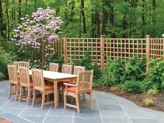 Garden fencing encloses outdoor dining area
