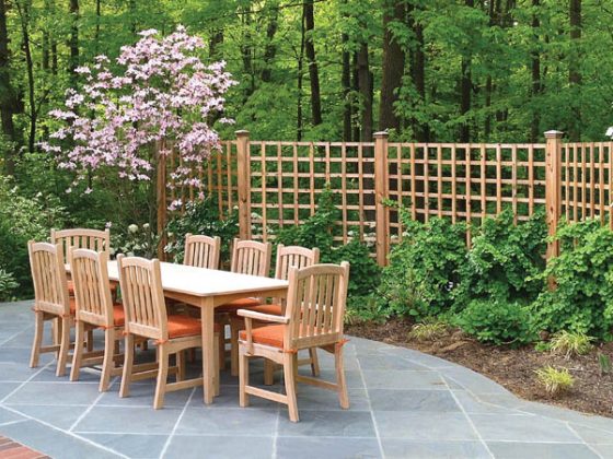 Garden fencing encloses outdoor dining area