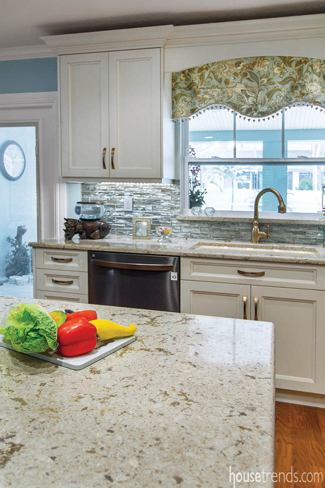 Gold hardware pops against white kitchen cabinetry