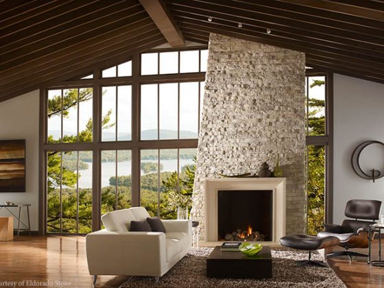 Stone fireplace stretches to the ceiling