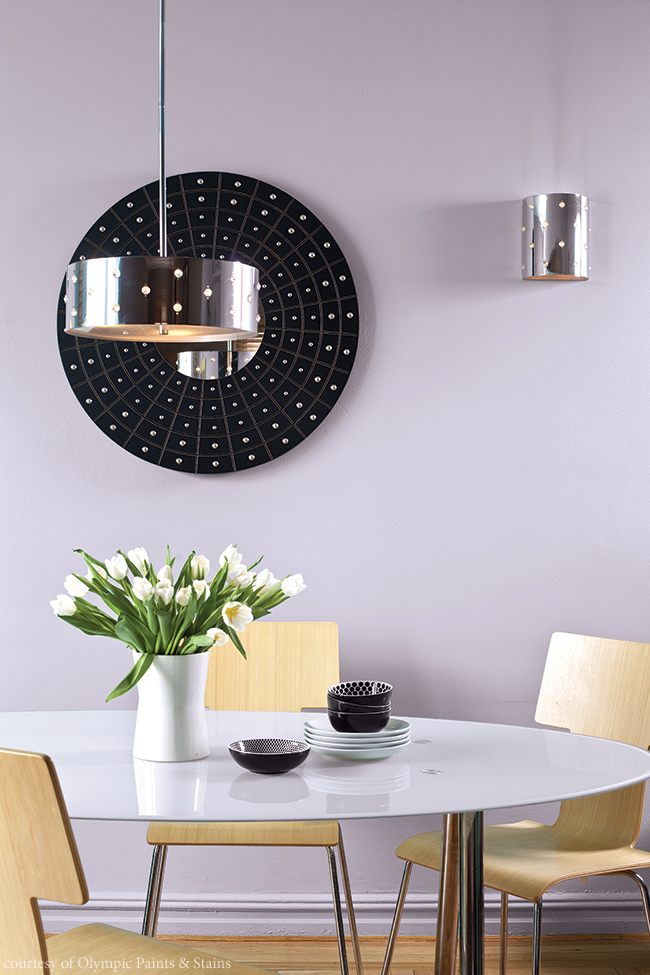 Purple walls pop in a minimalist kitchen design