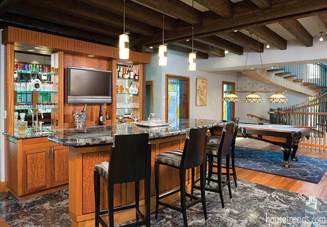 Pendant lights dangle over a bar