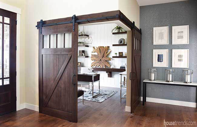 Barn doors lend privacy to a corner study