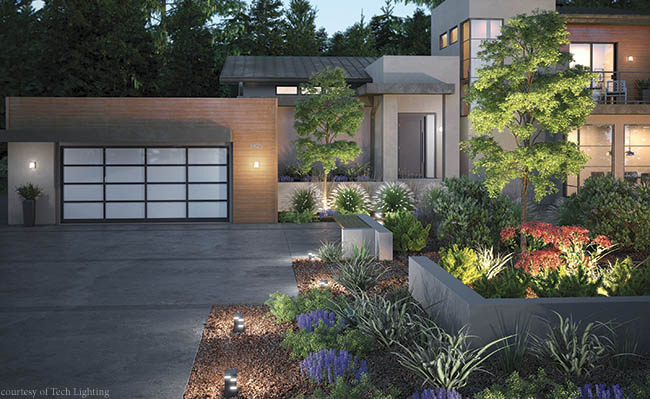 Landscape lighting illuminates a home
