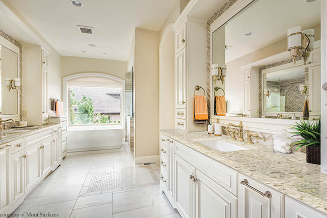 Quartz countertops complement a soothing master bath