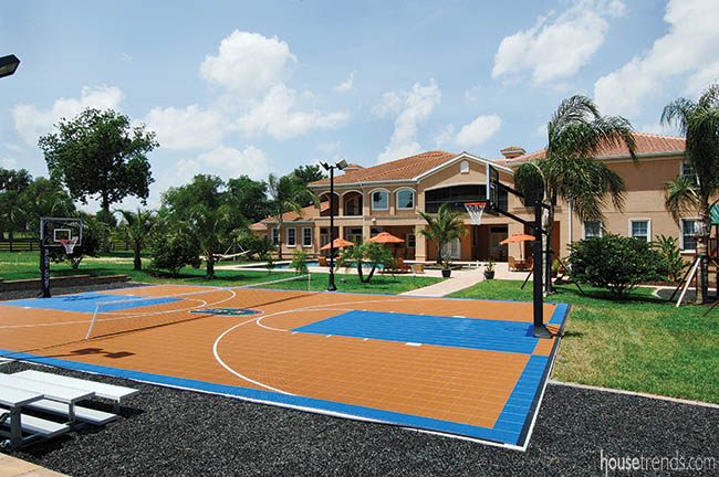 Bleachers flank an outdoor basketball court