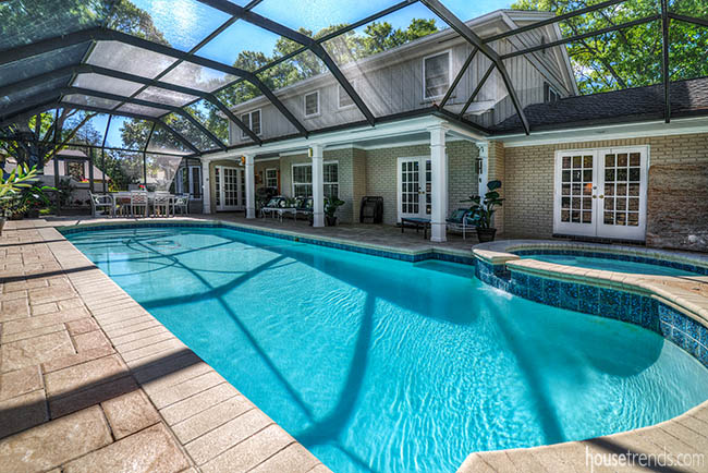 Pool dominates a screened-in back yard