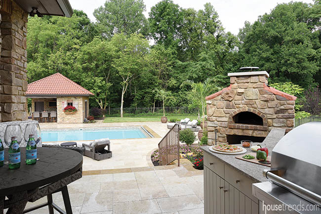 Outdoor kitchen has all the necessities for dining al fresco