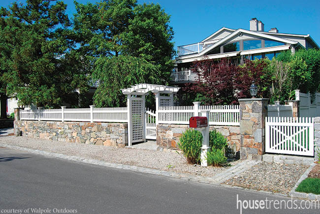 Home design gets a modern twist on a white picket fence