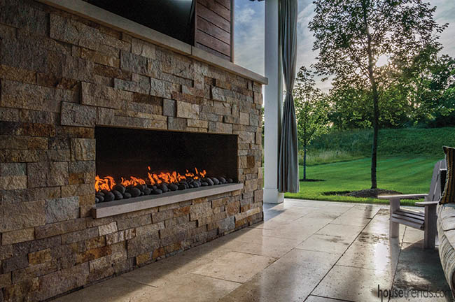 Outdoor fireplace warms up a covered pavilion