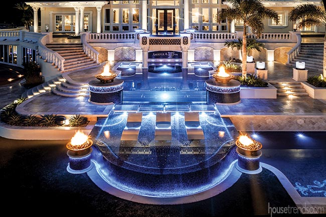 Fire bowls surround swimming pools